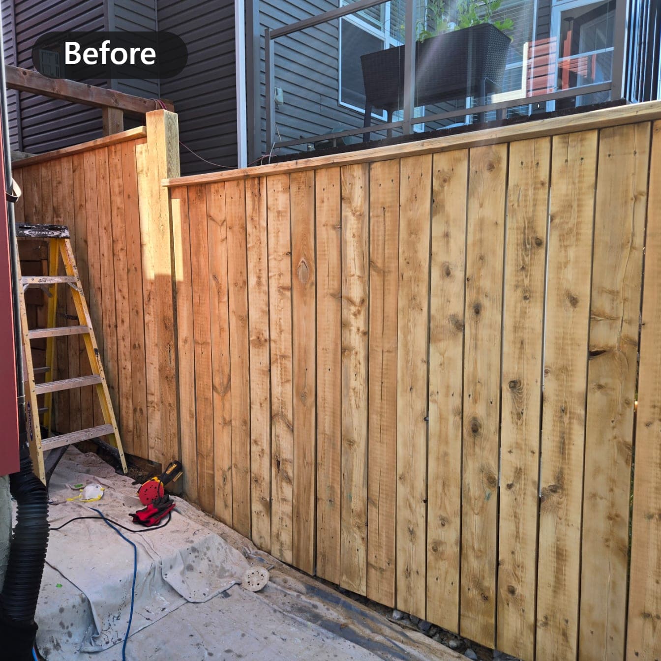 Weathered untreated cedar fence before staining