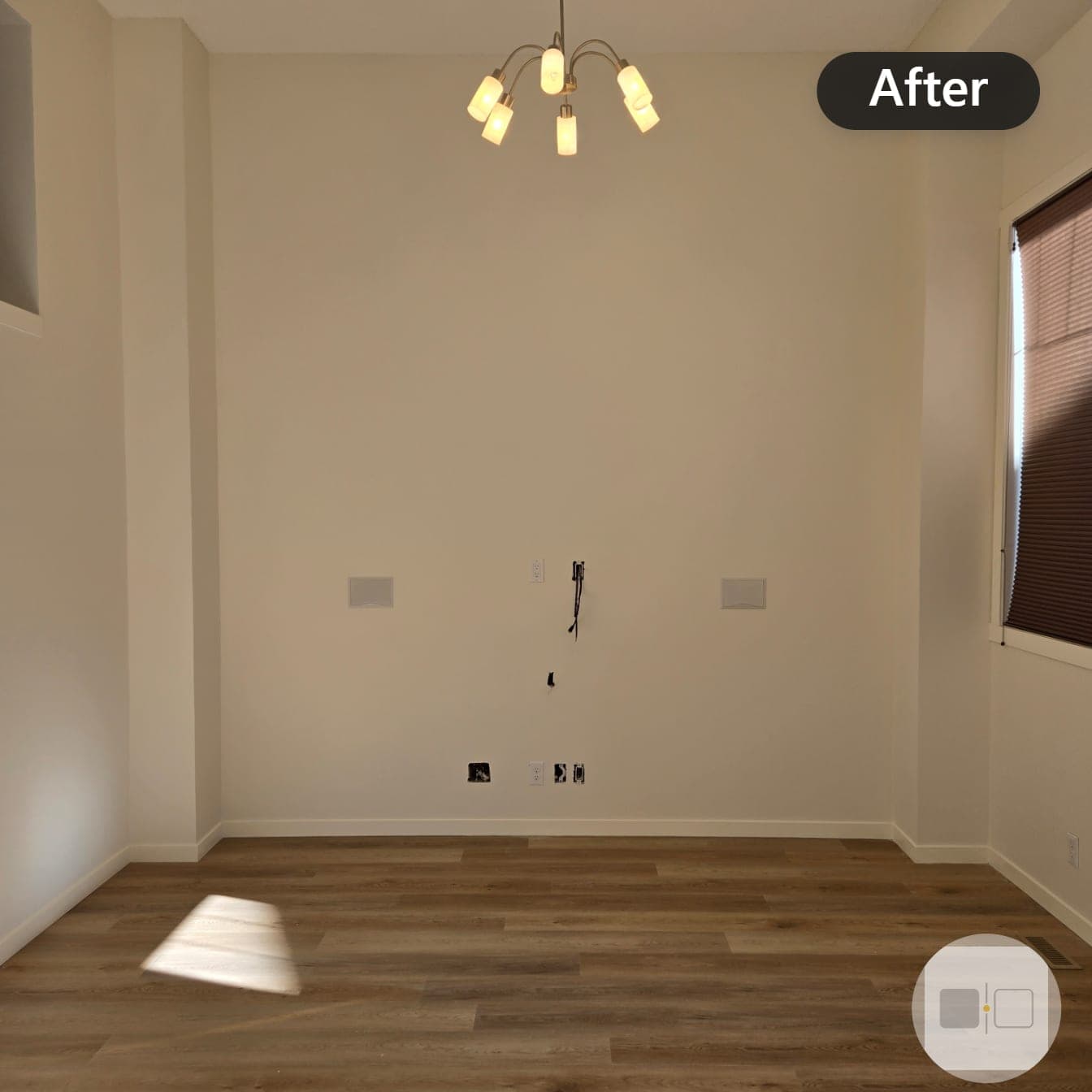 The same room after repainting in warm off-white, bright and freshly finished